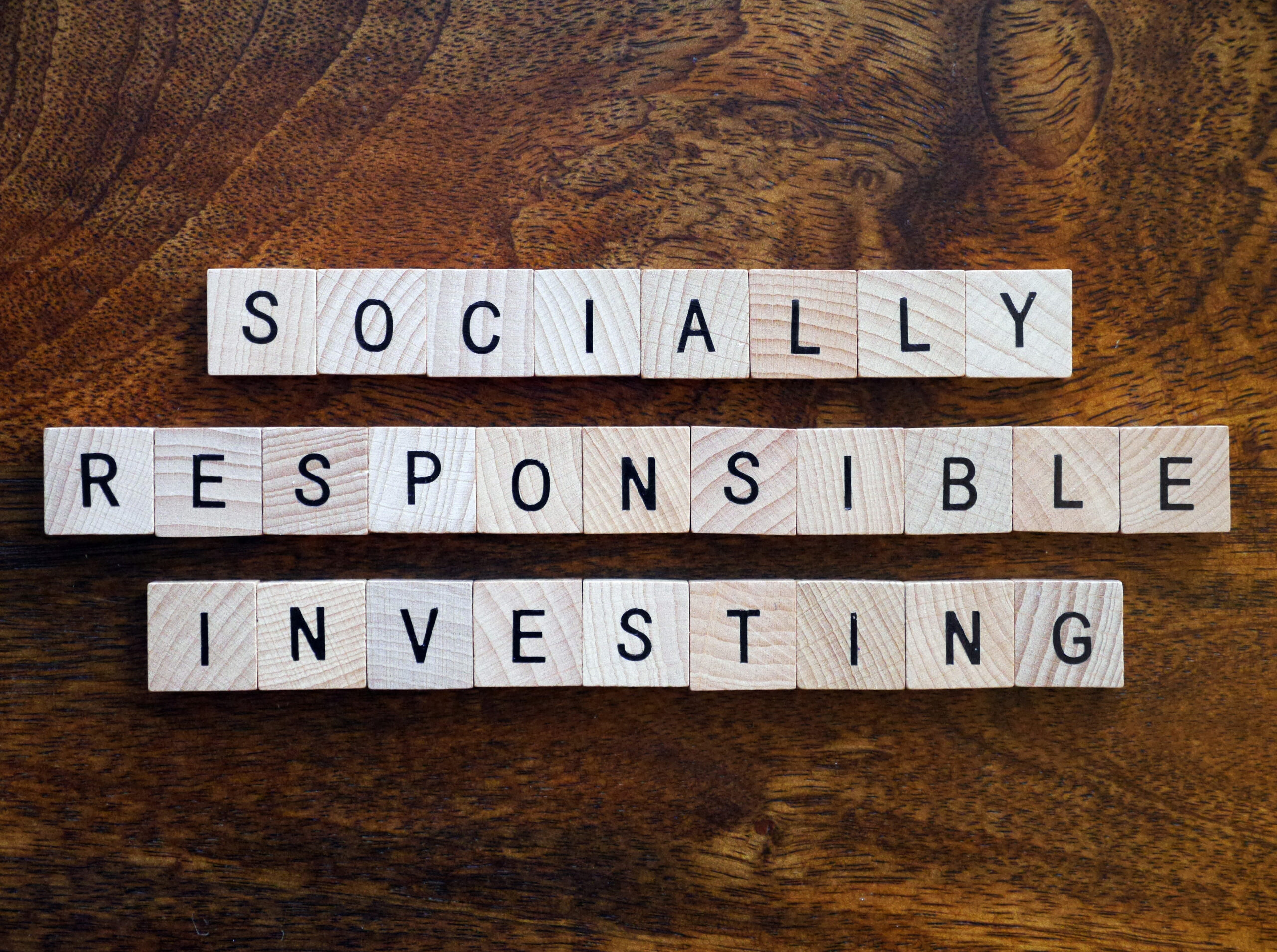 Scrabble tiles spell out "Socially Responsible Investing"