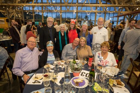 Sheri and Jeff Tonn (front right & back right) at an auction benefitting Communities for a Healthy Bay